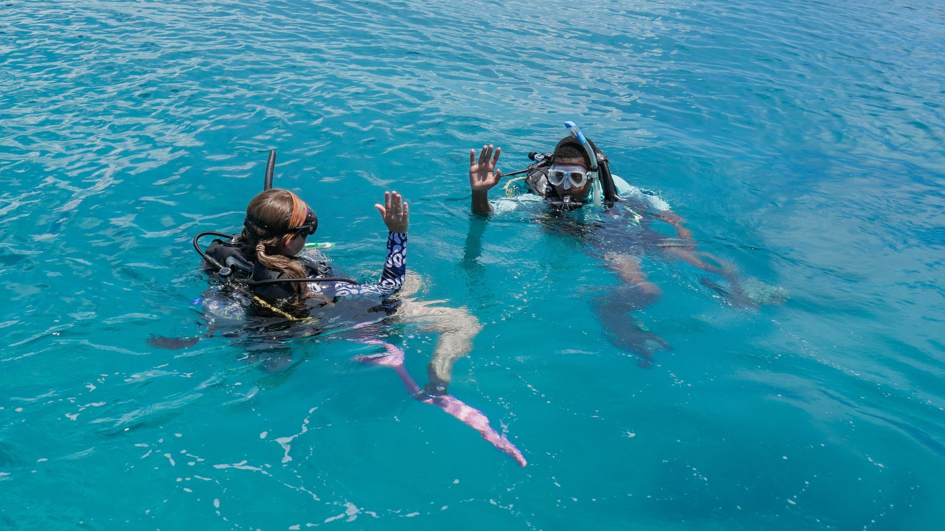 Two divers prepare to descend on a coral restoration site in Nassau.